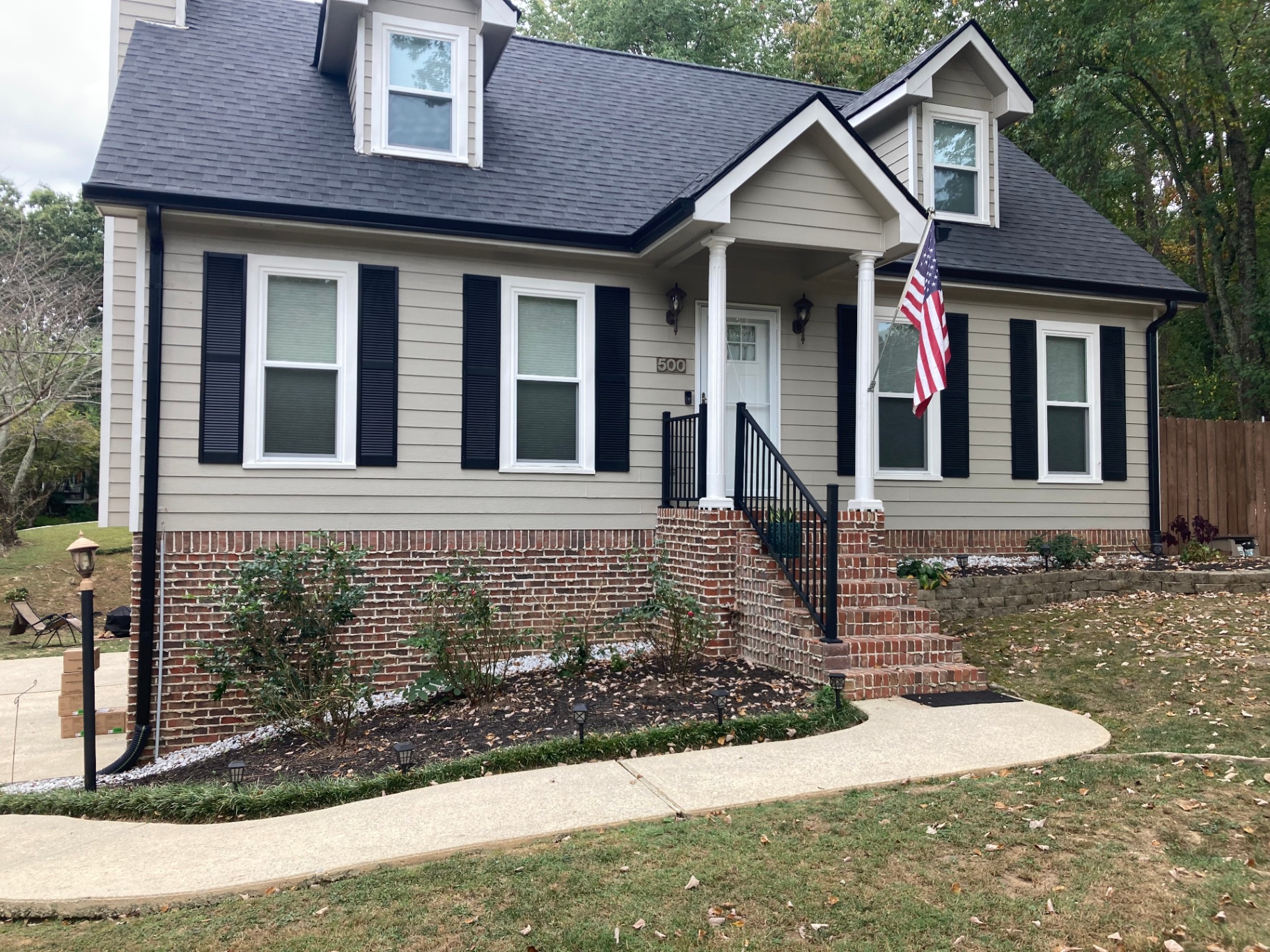 Traditional Home with Black Gutters